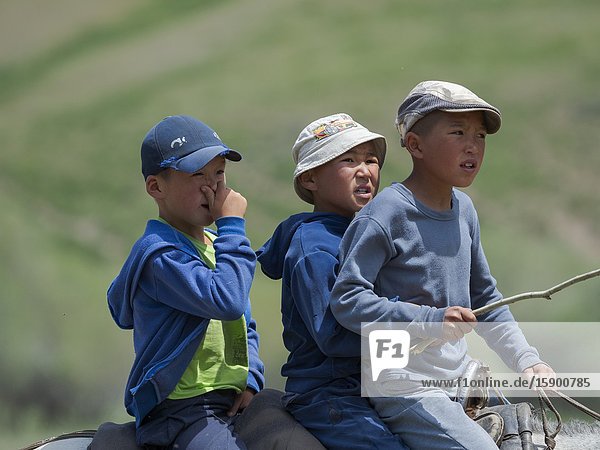 Child on horse.Folk Festival commemorating the origin myth the Tien Shan Maral (Tian Shan wapiti) an origin myth of the Kyrgyz tribes. Near Tasch Baschat Naryn region. Asia Central Asia Kyrgyzstan