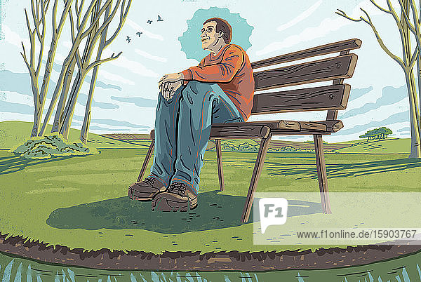 Mann sitzt auf einer Bank und genießt die Ruhe