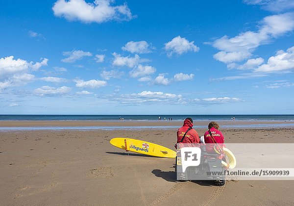 Lifeguards sitting on quad bike at Saltburn by the sea North Yorkshire England. United Kingdom.