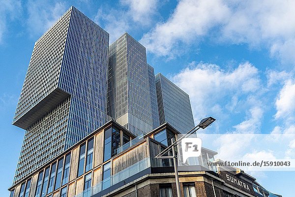 Tilburg Netherlands. Largest Dutch office building 'The Rotterdammer' just behind old and historical refurbished harbor warehouses on Wilhelminapier.