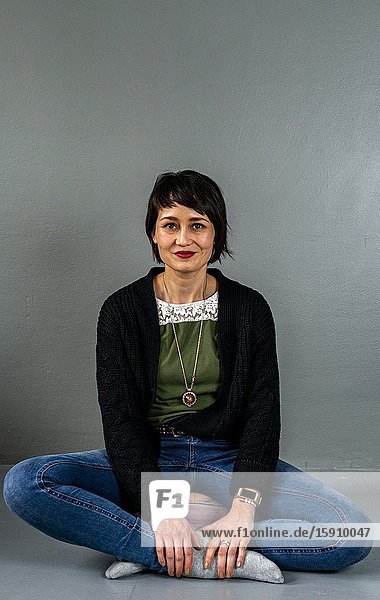 Tilburg Netherlands. Studio Portrait of an adult Dutch woman and mother with Indonesian roots.