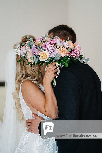 Elegant wedding bouquet of fresh natural flowers and greenery.