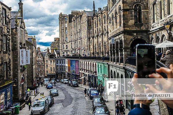 Taking a photo with the mobile to Victoria Street Old Town Edinburgh Scotland United Kingdom Europe.