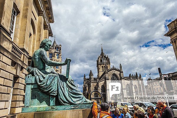 David Hume statue and St Giles' Cathedral or the High Kirk of Edinburgh Royal Mile High Street Old Town Edinburgh Scotland United Kingdom Europe.