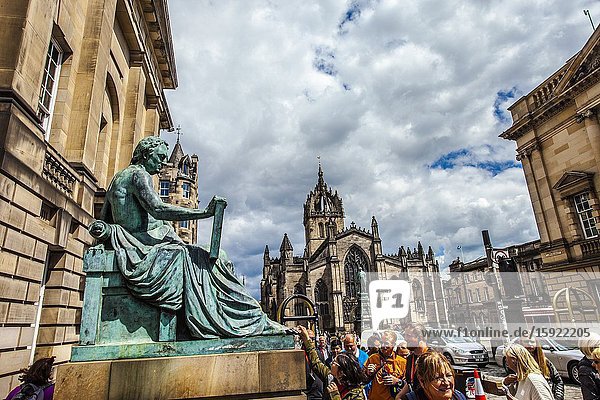 David Hume statue and St Giles' Cathedral or the High Kirk of Edinburgh Royal Mile High Street Old Town Edinburgh Scotland United Kingdom Europe.