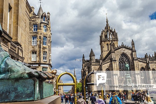 Foot of David Hume statue and St Giles' Cathedral or the High Kirk of Edinburgh Royal Mile High Street Old Town Edinburgh Scotland United Kingdom Europe.