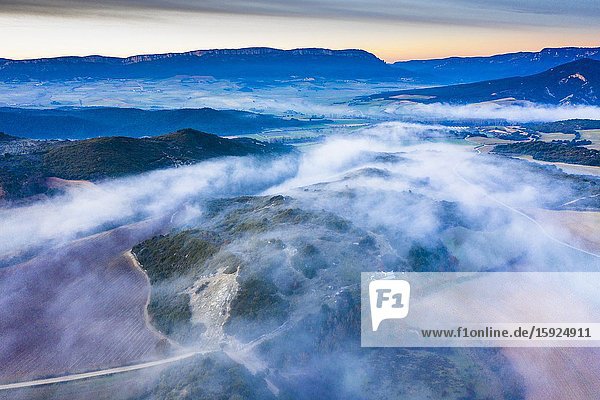 Agricultural area and fog. Aerial view. Ayegui area. Navarre Spain Europe.