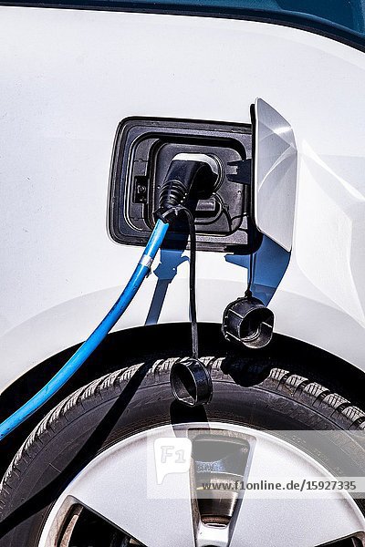 Car being charged at an electric car charging point Eindhoven The Netherlands Europe.