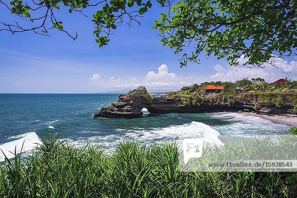 Sea arch at Tanah Lot Temple Bali Indonesia.