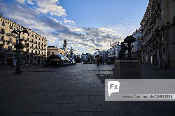 Empty streets and social distancing during the Coronavirus outbreak. Puerta del Sol with Oso and Madrono statue on April 29 2020 in Madrid