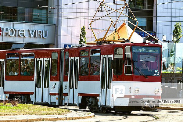 City trams at busy intersection. Tallinn Estonia.
