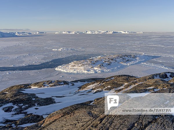 Winter at the Ilulissat Icefjord located in the Disko Bay in West Greenland the Icefjord is part of the UNESCO world heritage. America North America Greenland Denmark.
