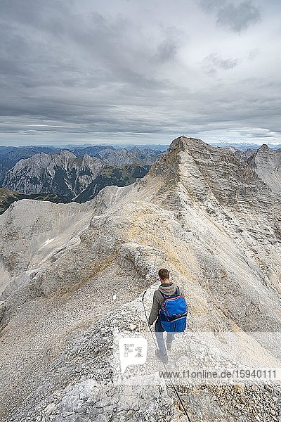 Mountaineer on the ridge of the Ödkarspitzen  view of the Birkkarspitze peak  Hinterautal-Vomper chain  Karwendel  Tyrol  Austria  Europe