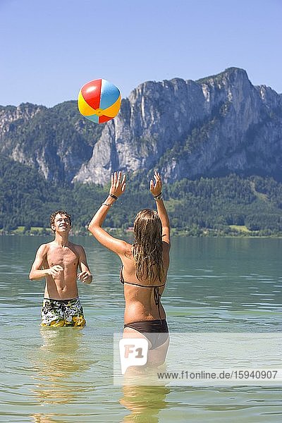 Two teenagers play with water polo in a lake  18 years  Mondsee  Upper Austria  Austria  Europe