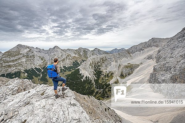 Mountaineer  hiker on the ascent to the Ödkarspitzen via the Brendelsteig  Hinterautal-Vomper chain  Karwendel  Tyrol  Austria  Europe