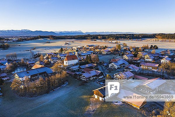 Village Lochen with church St. Magdalena in the morning light  near Dietramszell  Alpine chain  drone recording  foothills of the Alps  Upper Bavaria  Bavaria  Germany  Europe