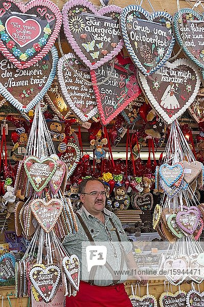 Booth with sweets  gingerbread hearts and souvenirs  Wiesn  Oktoberfest  Munich  Upper Bavaria  Bavaria  Germany  Europe