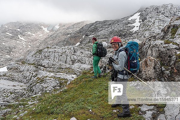 Two female mountaineers on route from Simonyhütte to Adamekhütte  rocky alpine terrain  Salzkammergut  Upper Austria  Austria  Europe