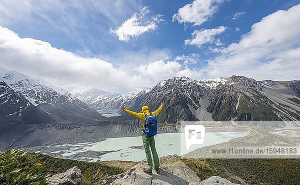 Hiker stretches his arms in the air  views of the Hooker Valley from the Sealy Tarns Track  glacial lakes Mueller Lake and Hooker Lake  Mount Cook National Park  Canterbury  South Island  New Zealand  Oceania