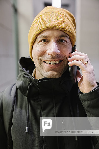 Portrait of smiling man on the phone