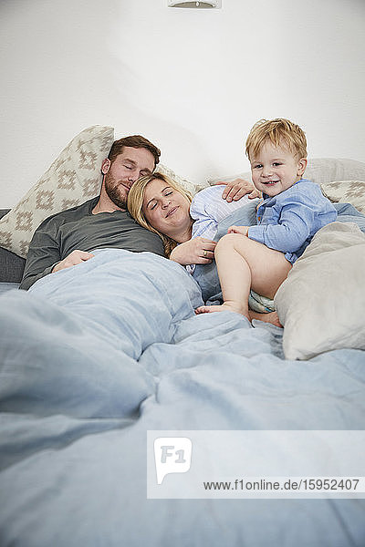 Family in the morning lying in bed