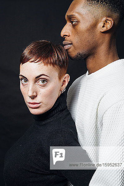 Studio portrait of mixed race couple