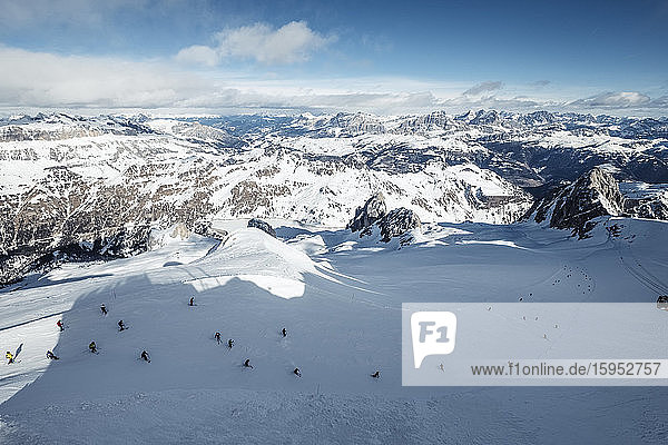 Italy  Trentino  Skiers seen from summit of Marmolada mountain