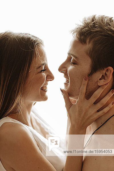 Portrait of happy intimate young couple