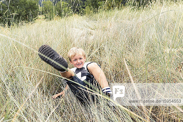 Portrait of smiling boy playing on a meadow