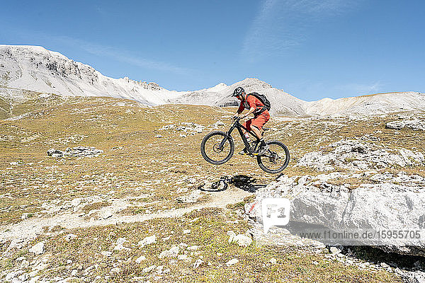 Man riding on mountainbike  Munestertal Valley  Grisons  Switzerland