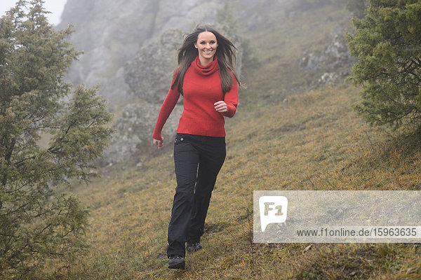 Brunette young woman hiking