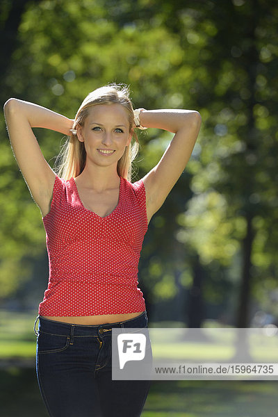 Young blond woman in a park