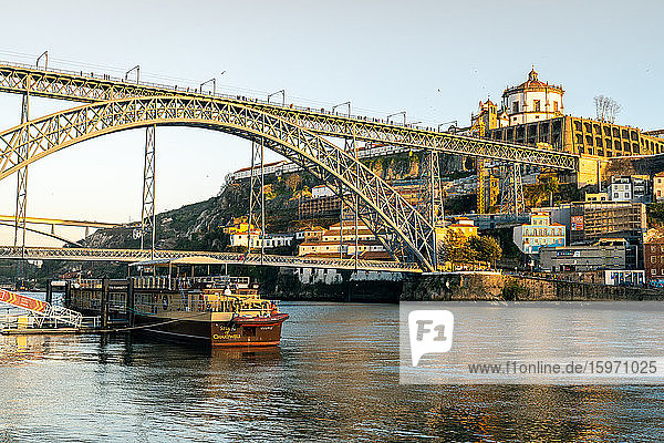 The Dom Luis I Bridge at sunset looking towards the Monastery of Serra do Pilar  UNESCO World Heritage Site  Porto  Portugal  Europe