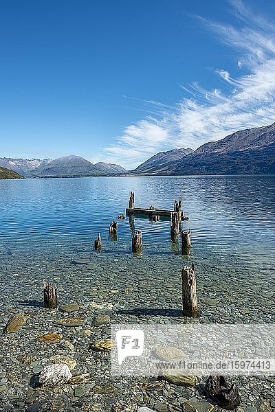 Decayed jetty  old wooden posts in Lake Wakatipu  near Glenorchy  Otago  South Island  New Zealand  Oceania