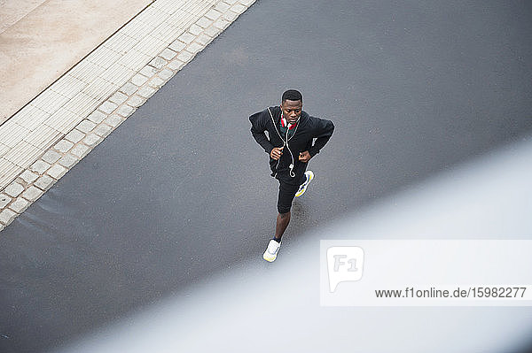 Young man jogging with headphone