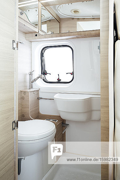 Small white bathroom inside motor home