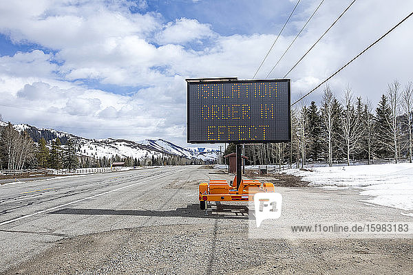 USA  Idaho  Sun Valley  COVID_19 lockdown on travel electronic sign on roadside