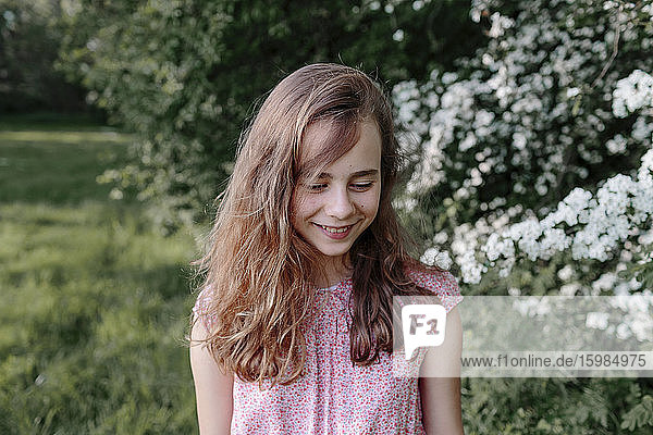 Portrait of a smiling girl in nature