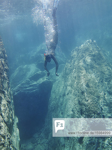 Spain  Catalonia  Cap de Creus  Woman diving in turquoise sea