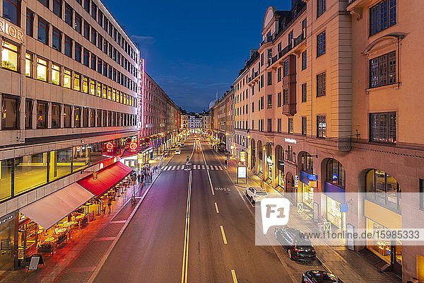 Sweden  Sodermanland  Stockholm  Illuminated Kungsgatan street at dusk