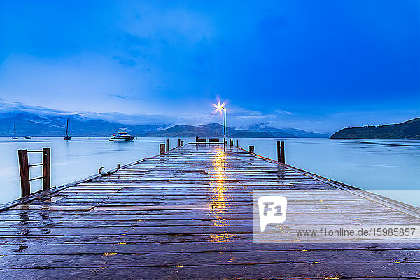 New Zealand  South Island  Akaroa  wooden pier at night