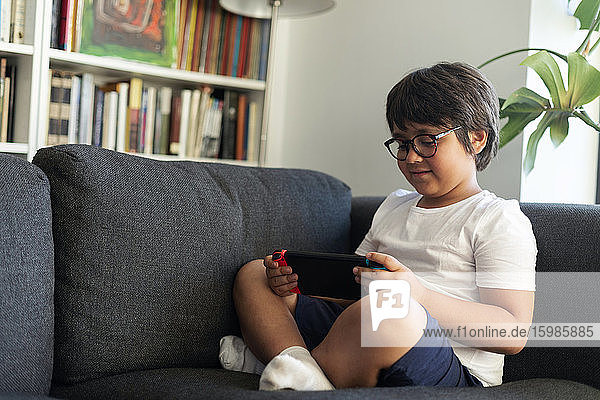 Boy playing video game on a games console