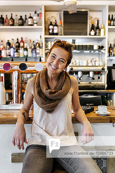Portrait of smiling woman in coffee shop