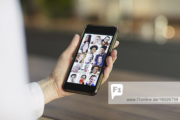 Friends video conferencing on smart phone screen