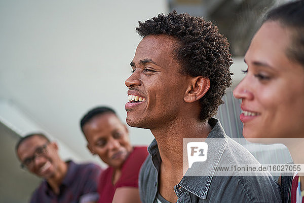 Young man hanging out with friends and laughing
