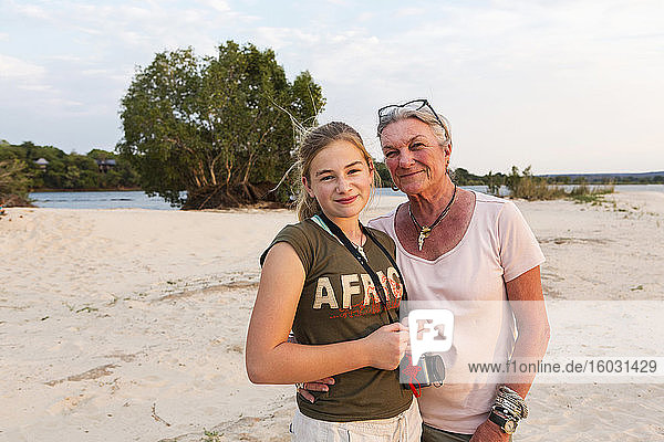 A senior woman and teenage girl  grandmother and her twelve year old grand daughter on vacation.