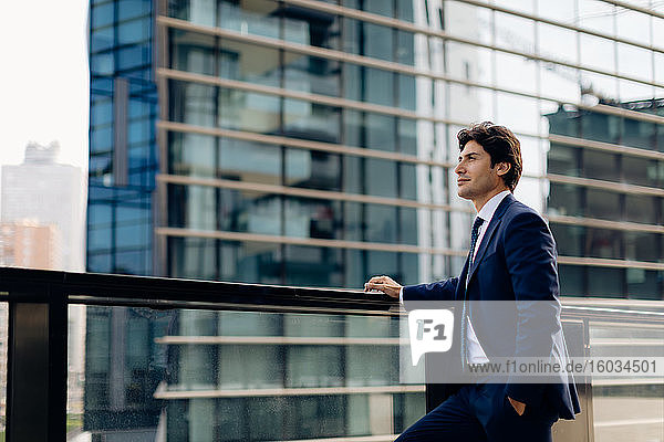 Businessman in front of office building