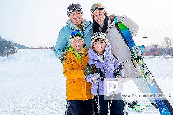 Happy young families to ski resort