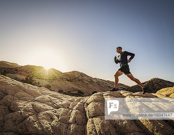 USA  Utah  St. George  Man running in rocky landscape
