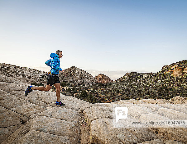 USA  Utah  St. George  Man running in rocky landscape